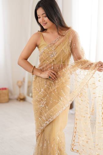 Chiku net beads & stones saree with unstitched blouse piece.