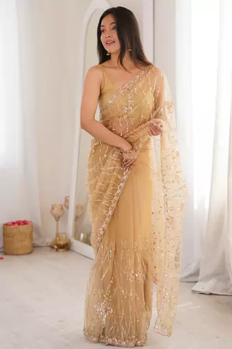 Chiku net beads & stones saree with unstitched blouse piece.