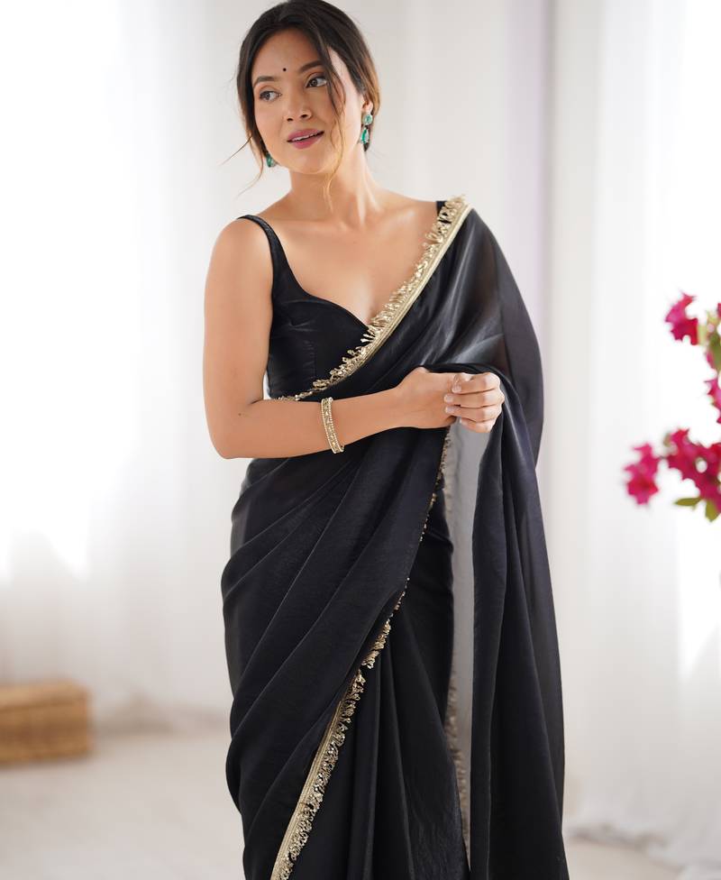 Black tissue satin sequins saree with unstitched blouse piece.