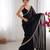 Black tissue satin sequins saree with unstitched blouse piece.