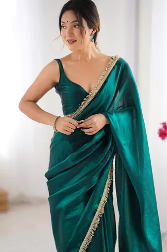 Green tissue satin sequins saree with unstitched blouse piece.