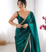 Green tissue satin sequins saree with unstitched blouse piece.