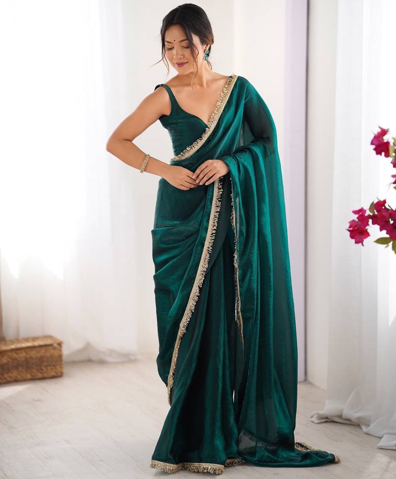 Green tissue satin sequins saree with unstitched blouse piece.