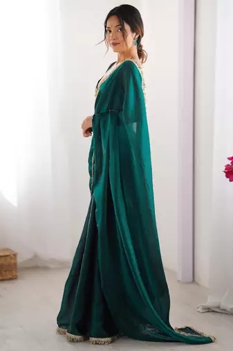 Green tissue satin sequins saree with unstitched blouse piece.