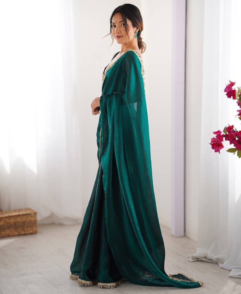 Green tissue satin sequins saree with unstitched blouse piece.