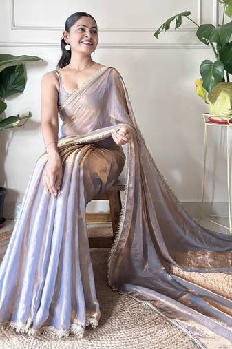 Lilac tissue satin sequins saree with unstitched blouse piece.