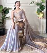 Lilac tissue satin sequins saree with unstitched blouse piece.