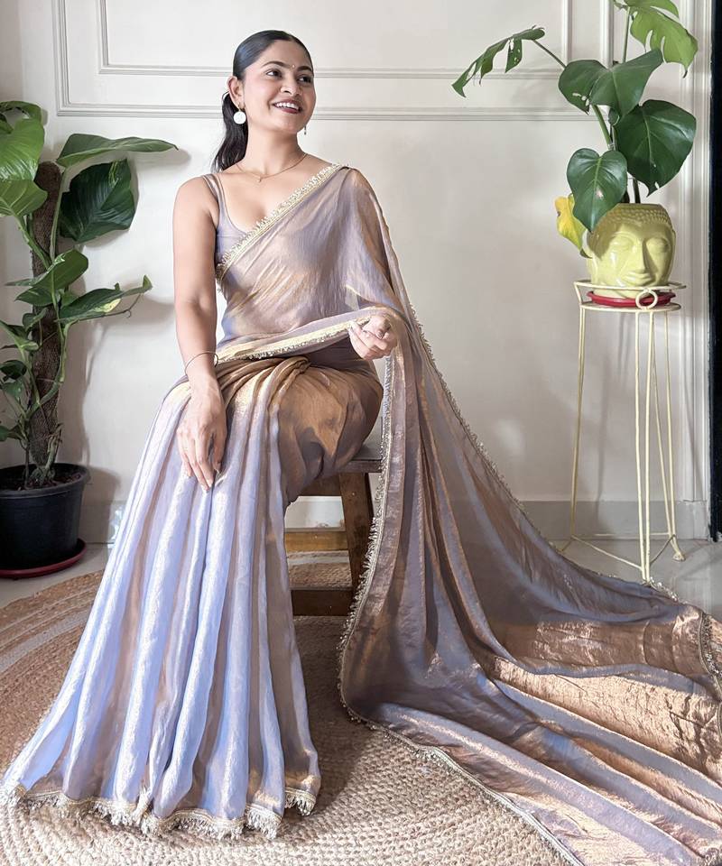 Lilac tissue satin sequins saree with unstitched blouse piece.