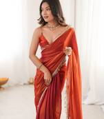 Orange tissue satin sequins saree with unstitched blouse piece.