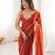 Orange tissue satin sequins saree with unstitched blouse piece.