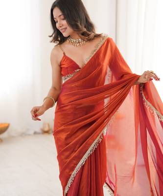Orange tissue satin sequins saree with unstitched blouse piece. 3
