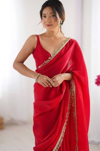 Red tissue satin sequins saree with unstitched blouse piece.