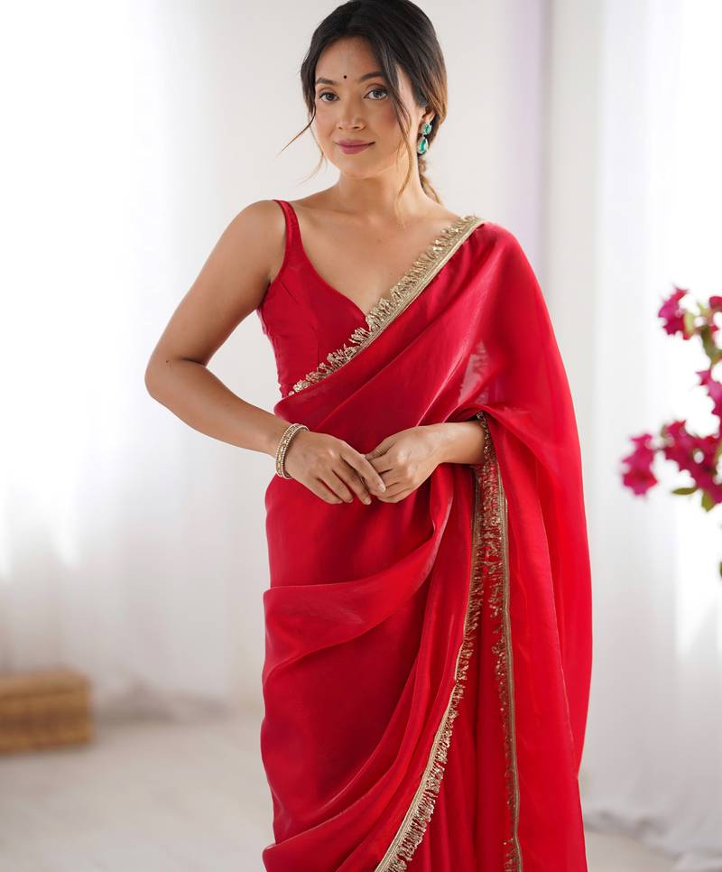 Red tissue satin sequins saree with unstitched blouse piece.