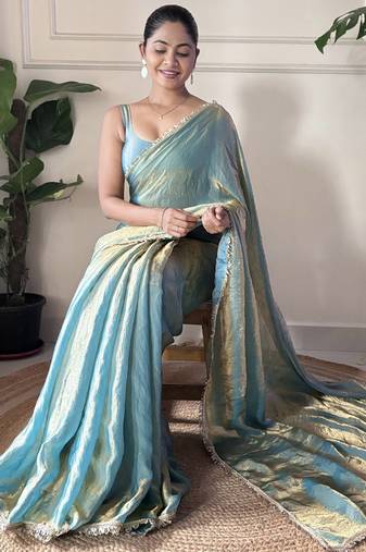 Sky blue tissue satin sequins saree with unstitched blouse piece.