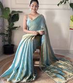 Sky blue tissue satin sequins saree with unstitched blouse piece.