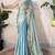 Sky blue tissue satin sequins saree with unstitched blouse piece.