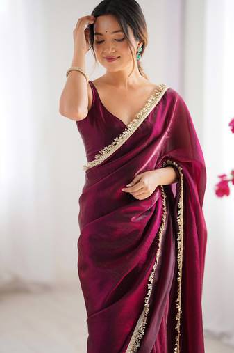 Wine tissue satin sequins saree with unstitched blouse piece.
