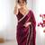 Wine tissue satin sequins saree with unstitched blouse piece.