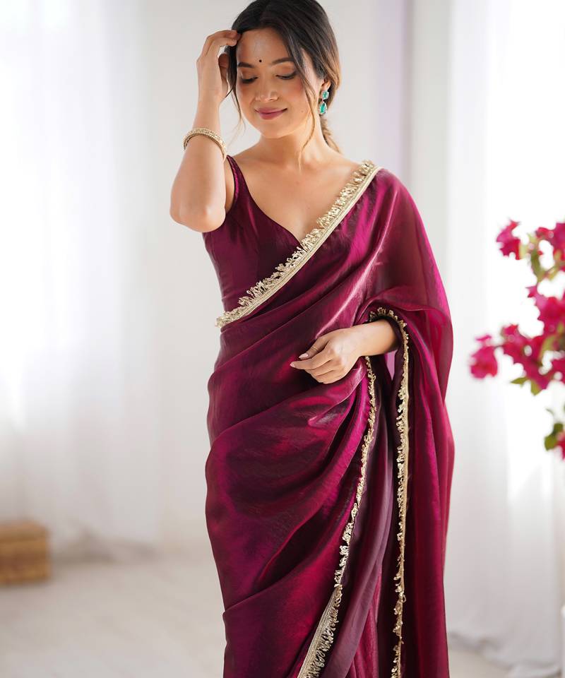 Wine tissue satin sequins saree with unstitched blouse piece.