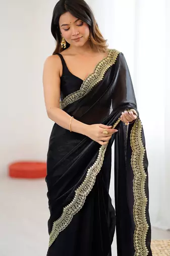 Black tissue satin sequins saree with unstitched blouse piece.