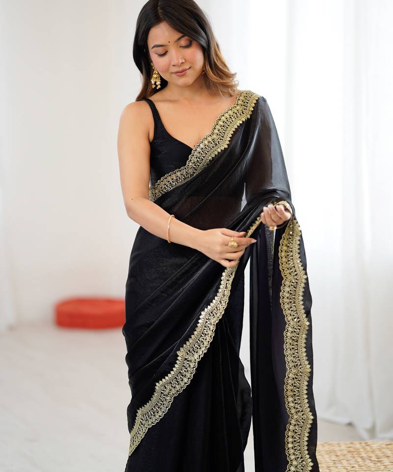 Black tissue satin sequins saree with unstitched blouse piece.