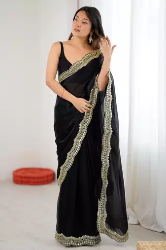 Black tissue satin sequins saree with unstitched blouse piece.