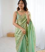 Green tissue satin sequins saree with unstitched blouse piece.