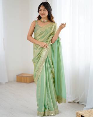 Green tissue satin sequins saree with unstitched blouse piece. 2