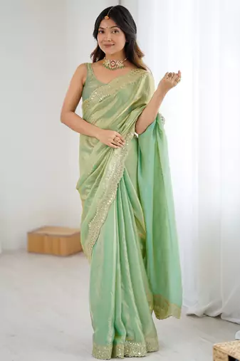 Green tissue satin sequins saree with unstitched blouse piece.