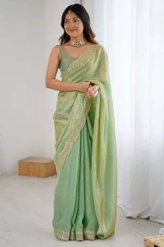 Green tissue satin sequins saree with unstitched blouse piece.