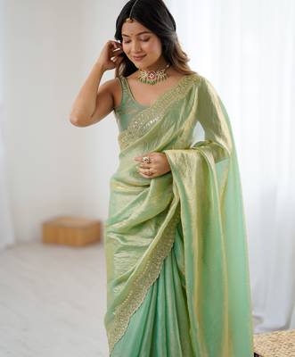 Green tissue satin sequins saree with unstitched blouse piece. 4
