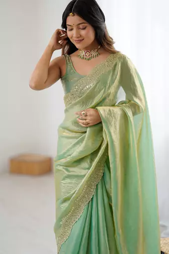 Green tissue satin sequins saree with unstitched blouse piece.