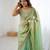 Green tissue satin sequins saree with unstitched blouse piece.