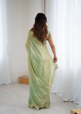 Green tissue satin sequins saree with unstitched blouse piece. 5
