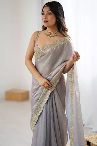Grey tissue satin sequins saree with unstitched blouse piece.