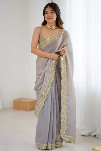 Grey tissue satin sequins saree with unstitched blouse piece.