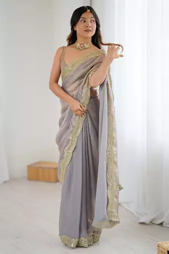 Grey tissue satin sequins saree with unstitched blouse piece.