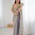 Grey tissue satin sequins saree with unstitched blouse piece.