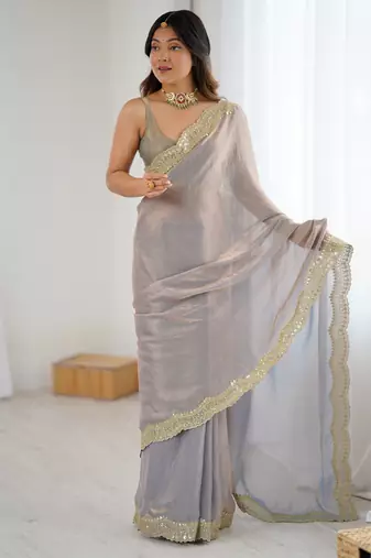 Grey tissue satin sequins saree with unstitched blouse piece.