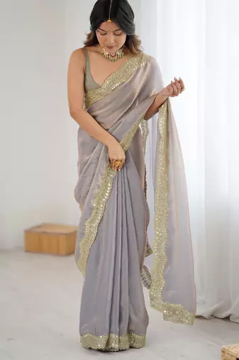 Grey tissue satin sequins saree with unstitched blouse piece.
