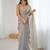 Grey tissue satin sequins saree with unstitched blouse piece.