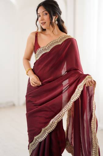 Maroon tissue satin sequins saree with unstitched blouse piece.