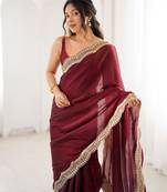 Maroon tissue satin sequins saree with unstitched blouse piece.