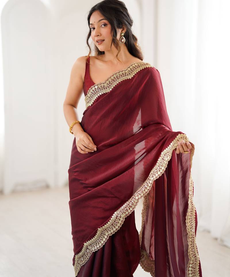 Maroon tissue satin sequins saree with unstitched blouse piece.