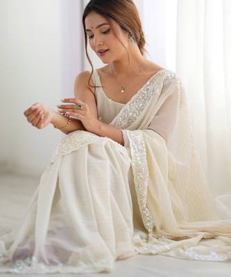 Cream georgette sequins saree with unstitched blouse piece. 1