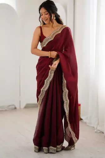 Maroon tissue satin sequins saree with unstitched blouse piece.