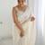Cream georgette sequins saree with unstitched blouse piece.