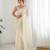 Cream georgette sequins saree with unstitched blouse piece.