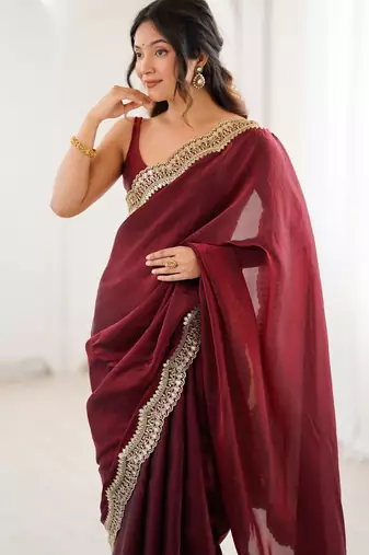 Maroon tissue satin sequins saree with unstitched blouse piece.