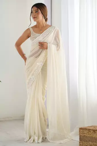Cream georgette sequins saree with unstitched blouse piece.